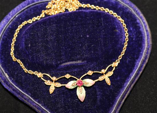 An Edwardian 15ct gold, ruby, seed pearl and enamel pendant necklace, 16in.